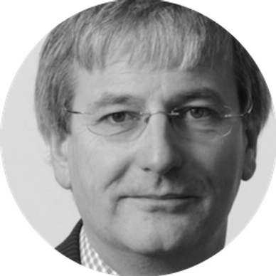 Black and white portrait of a middle-aged man with glasses.