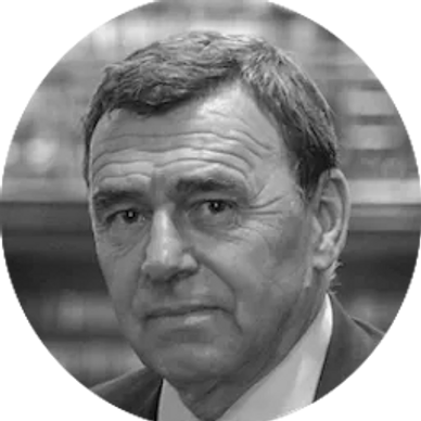 Black and white portrait of an older man in a suit.