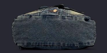 Bottom view of a black denim jacket with a button closure.