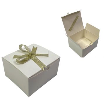 Pastry box and bakery box with gold ribbon ties to the top with die cut slits