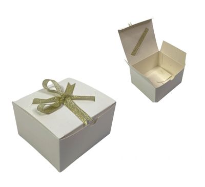 White pastry boxes with gold ribbon 