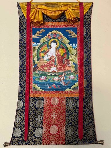Nagarjun Buddha Thangka with  a silk brocade frame.