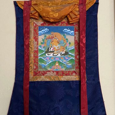 Beautiful small Zambala/Jambala Thangka molded with Silk brocade