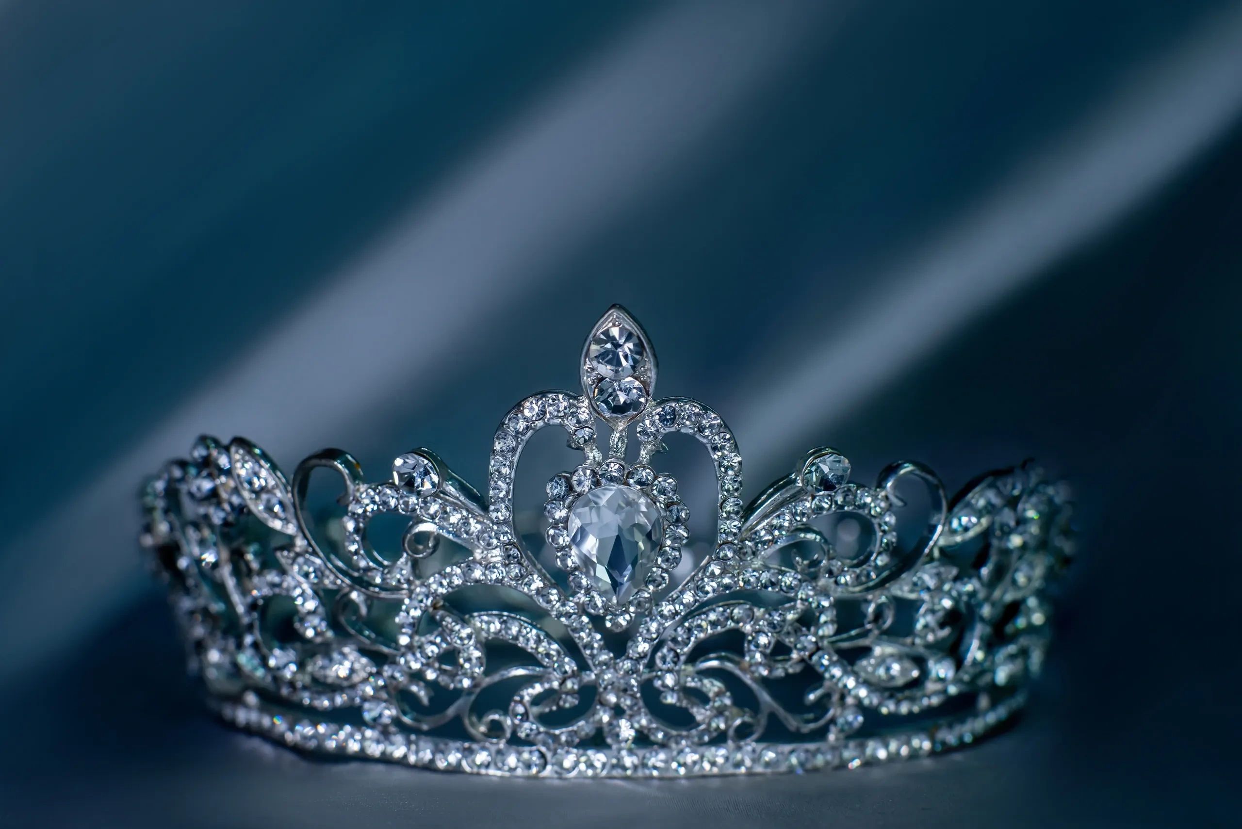 Close-up of a sparkling jeweled tiara with intricate design.
