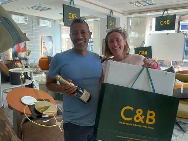 Our First clients receiving a complimentary bottle of champagne as our way of saying thank you.