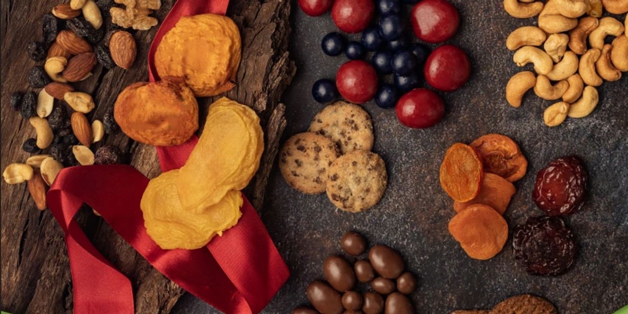 Gourmet Christmas cookies, chocolates, chips, nuts, and dried fruit.