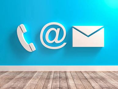 Icons of phone, email, and envelope on a blue wall with wooden floor.