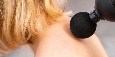 Muscular mobilization through a massager gun.