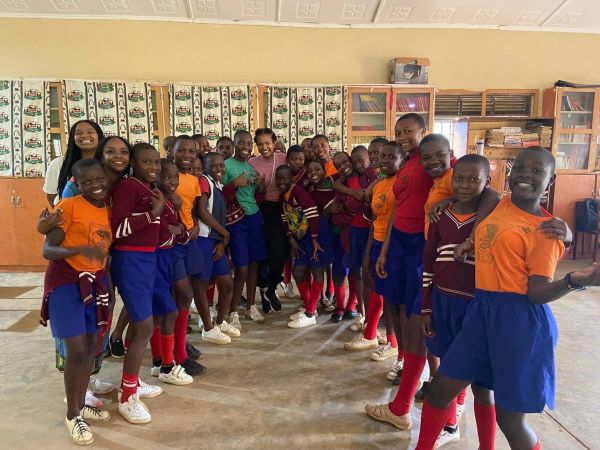 Group of joyful school children posing indoors.