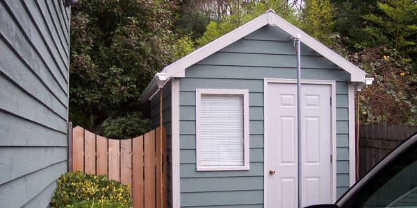 Custom shed and never-sag cedar gate, built to match the details of the home.