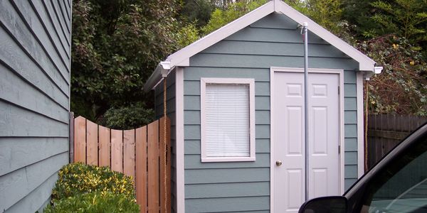 Custom shed and never-sag cedar gate, built to match the details of the home.