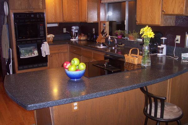 Custom Corian countertops with coved splash and curved edges.