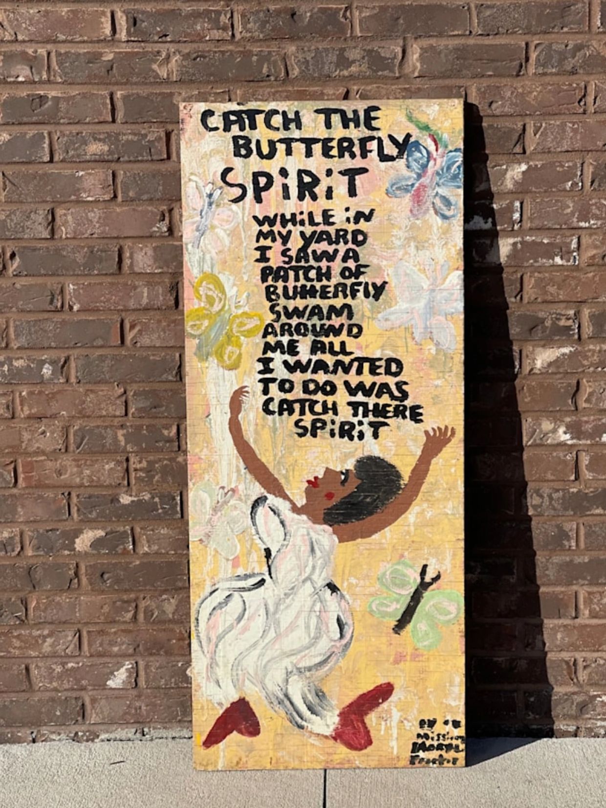 Painting with butterfly spirit poem and figure reaching up.