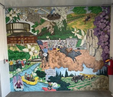 A colorful mural depicting agriculture, rodeo, and community life.
