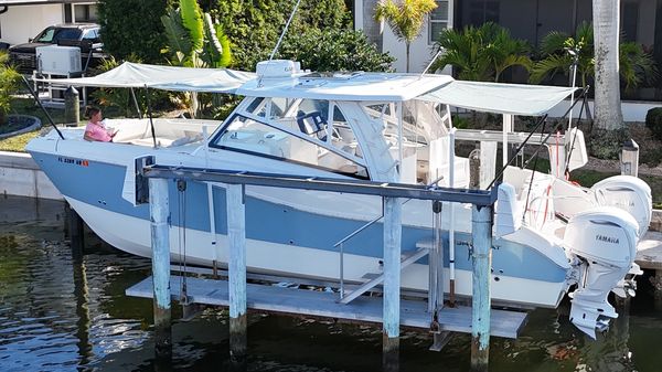 Phifertex + Forward and Aft Shade Sail with a black CUSTOM FIT 6 pole Carbon Fiber Assembly