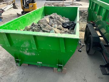 Debris collected on rental bin