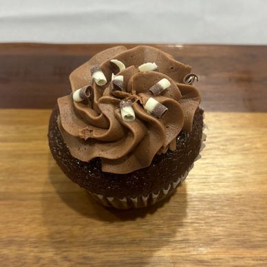  Chocolate cupcake with chocolate frosting, sprinkled with chocolate curls 