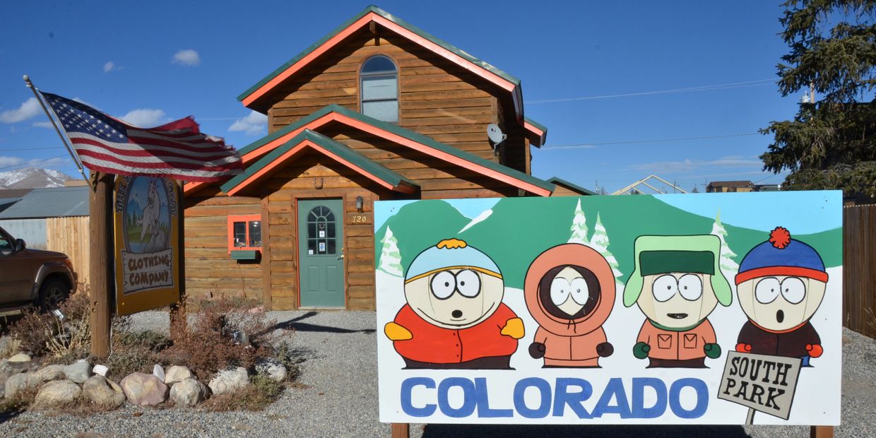 Wooden building with a South Park Colorado sign featuring cartoon characters.