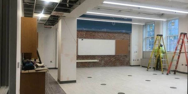Renovation of commercial spaces with new LVT, ceiling grid, cabinetry and well executed finishes