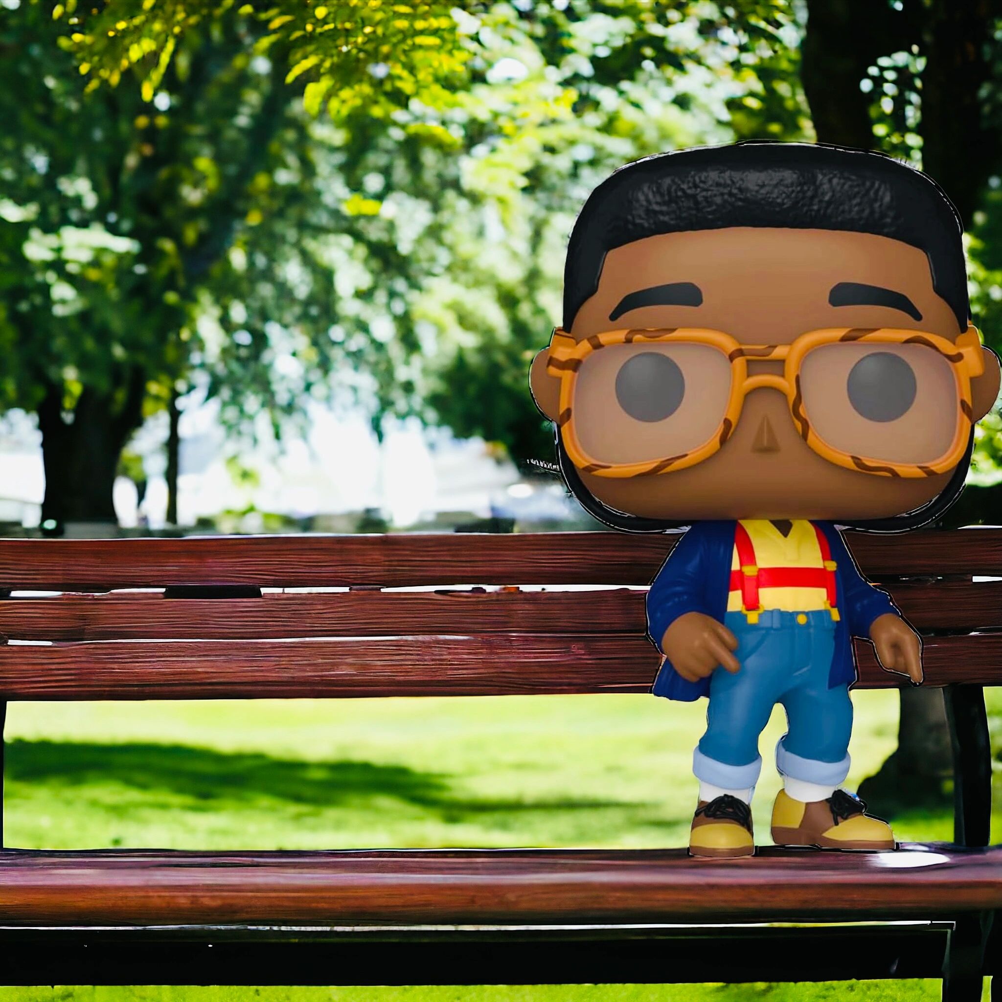 Steve Uriel Funko Pop standing on a bench in the park