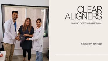 Three people, two doctors presenting clear aligners to a woman patient.