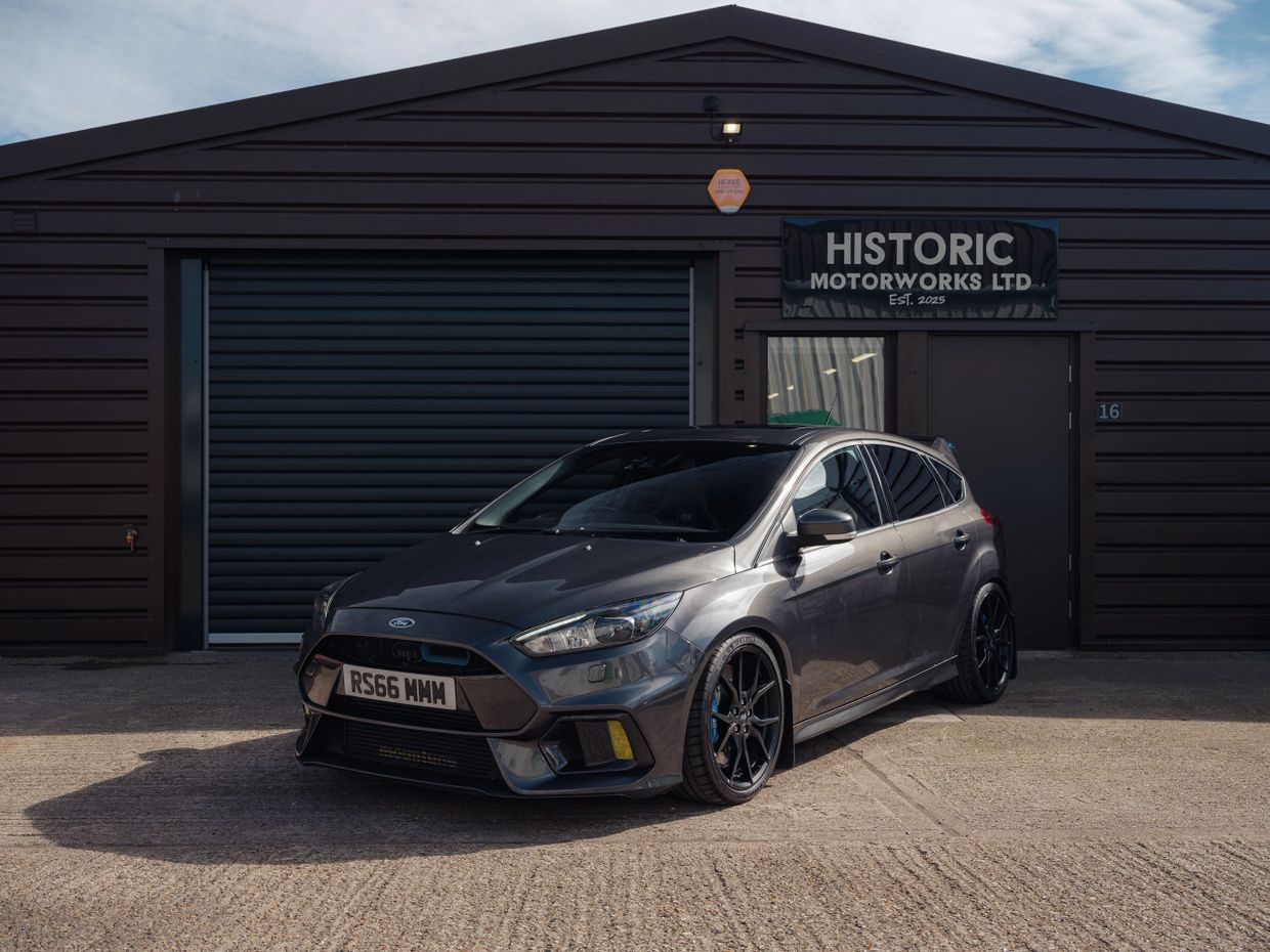 Grey Ford Focus RS parked outside Historic Motorworks Ltd garage.