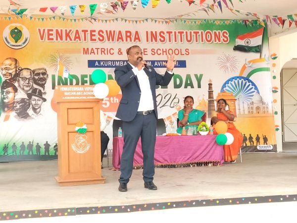 Man speaking at Venkateswara Institutions event.