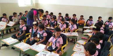 Young students in a busy classroom.