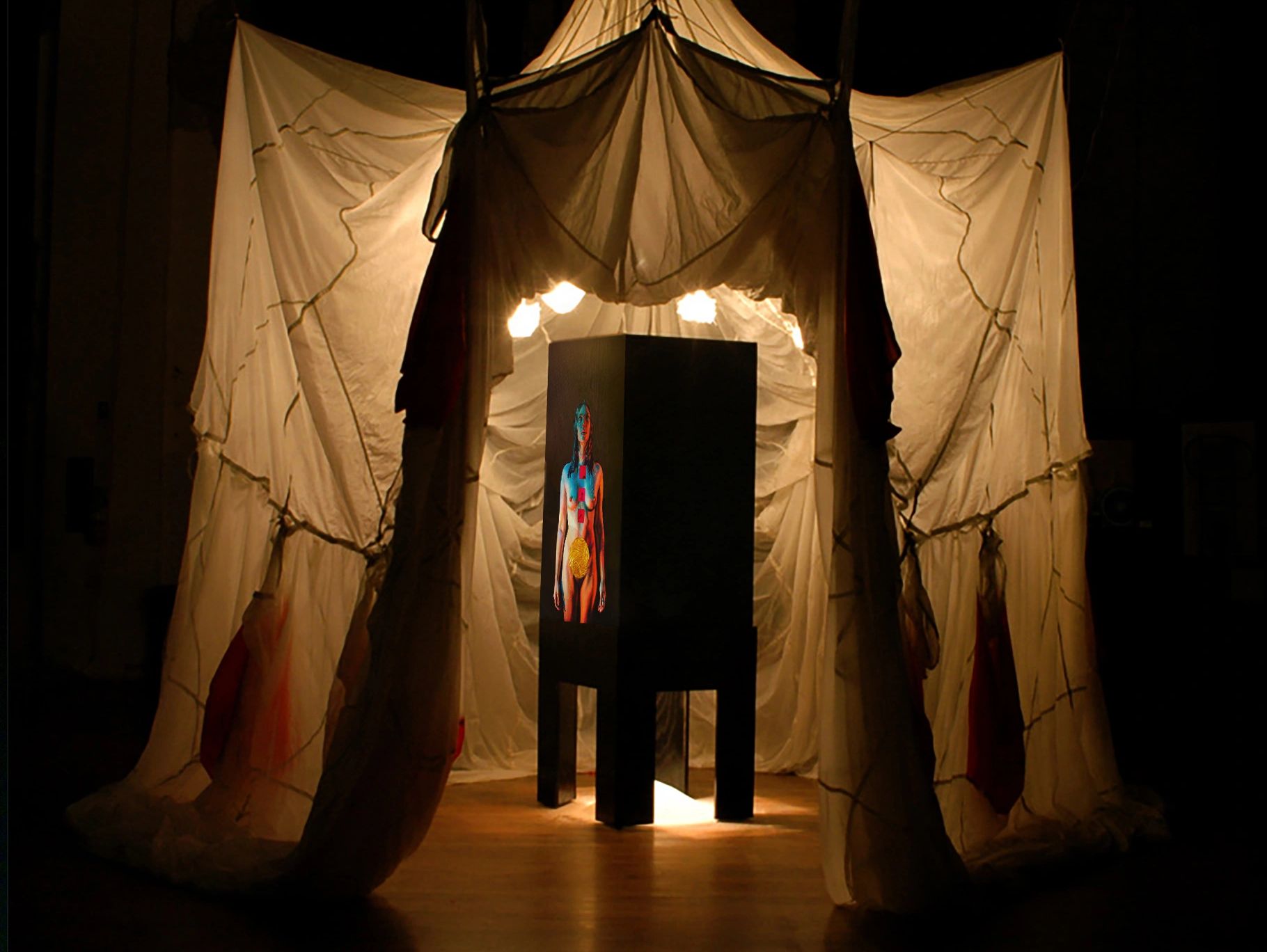 Mono no Aware exterior, three parachutes, lit with kiln form glass wrapped lightbulbs 