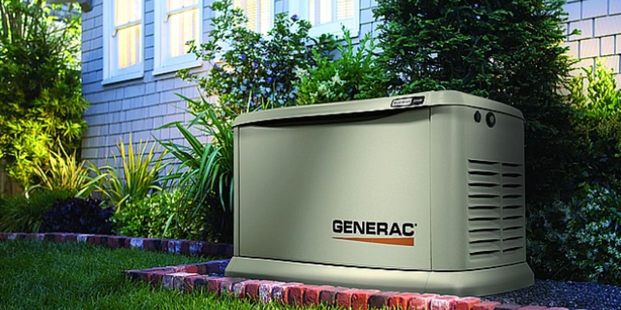 Generac outdoor home generator installed by a house.