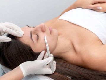 Woman relaxing while receiving the best dermaplaning in Everett, WA at Autumn Noel Esthetics.