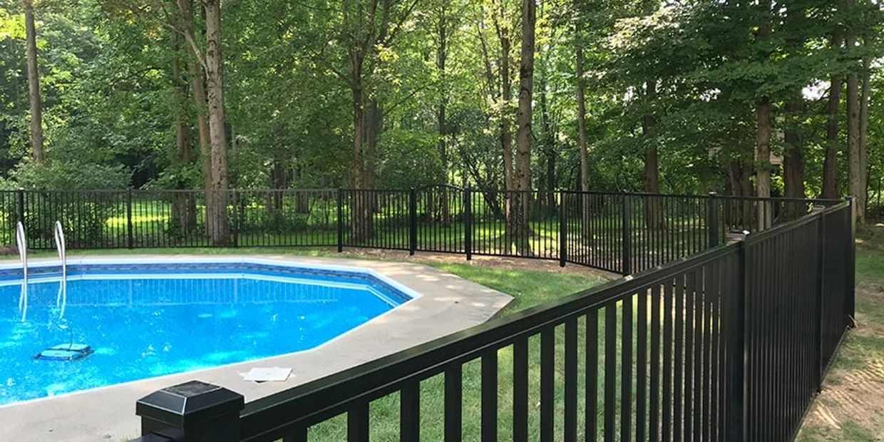 aluminum pool fence in Rochester NY backyard
black aluminum pool safety fence around inground pool