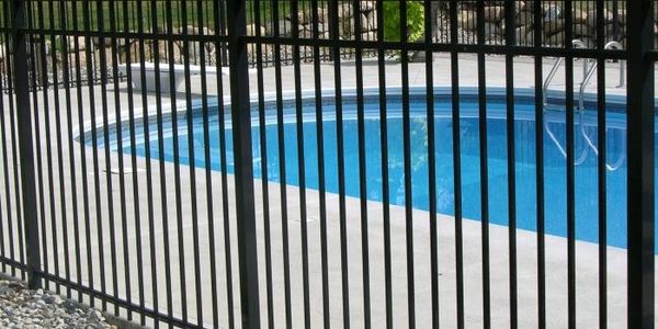 black aluminum pool safety fence around inground pool
pool fence installation Rochester NY