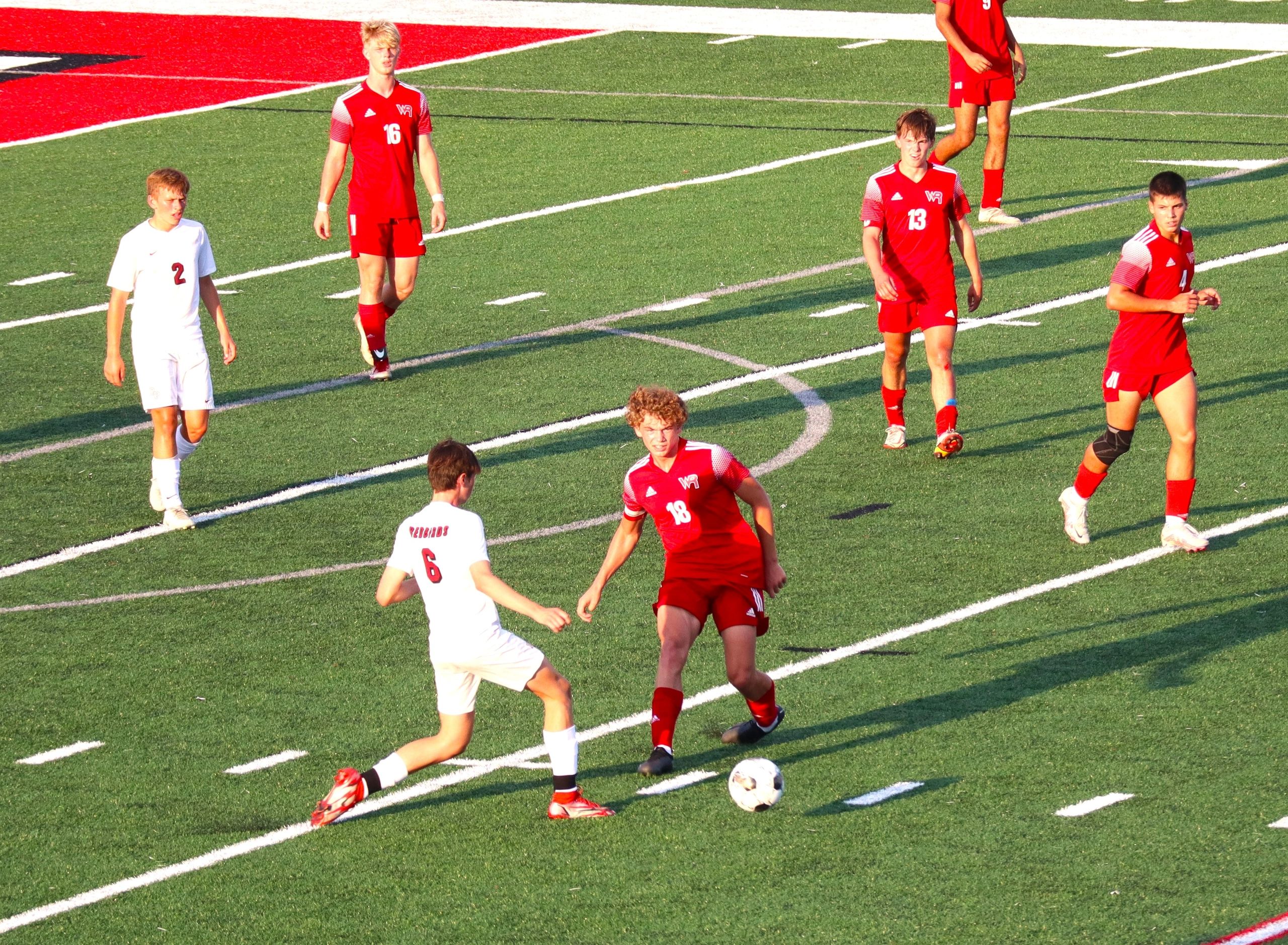 Raiders, Red Birds draw in opening game.