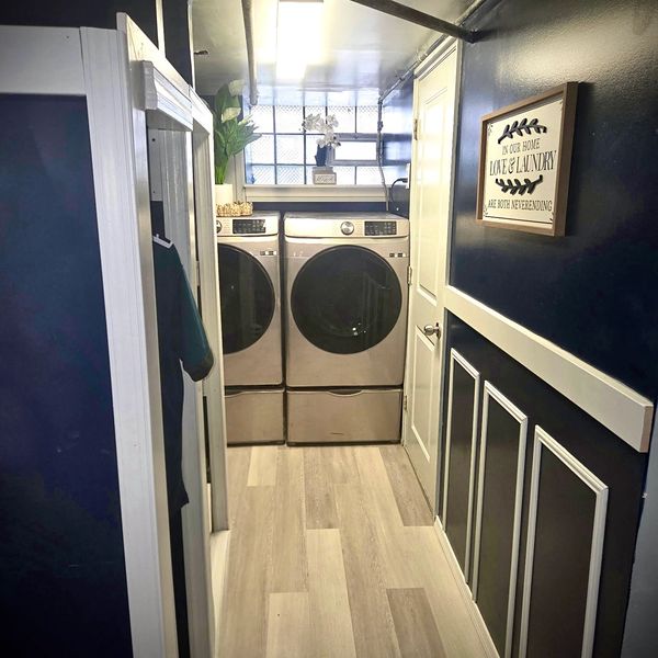 Custom-built laundry room with modern washer and dryer.