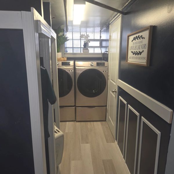 Modern laundry room with washer and dryer.