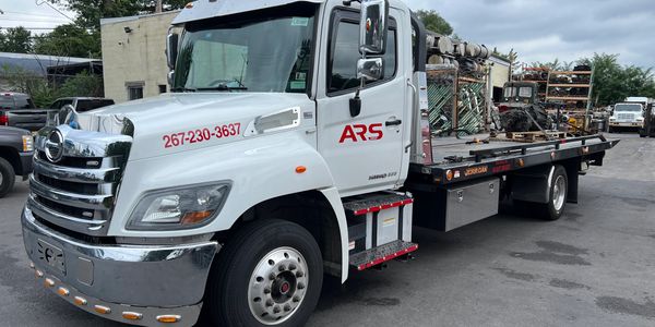 Equipment hauling by ARS Towing