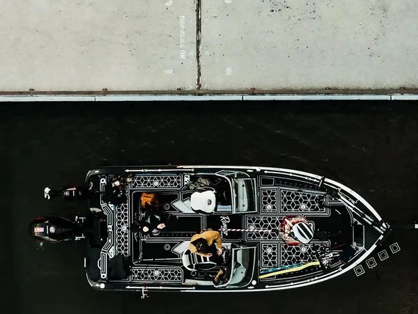 Marine boat flooring drone view fishing boat on water