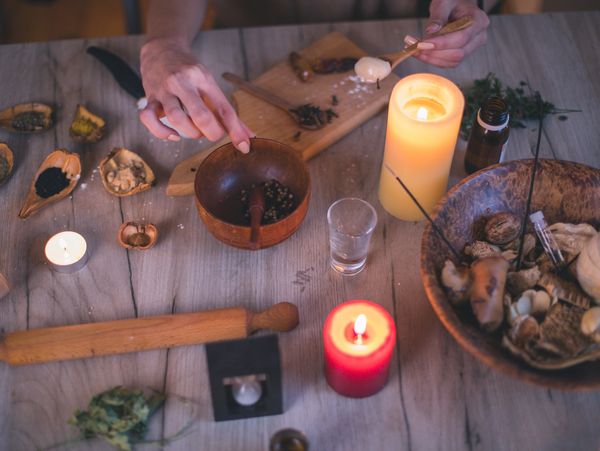 Assortment of handmade natural wax candles and ingredients.