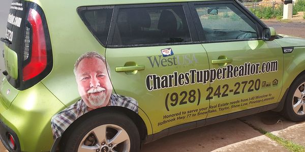 Charles promotes his business while driving all over the areas he works and visits.