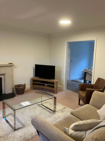 Lounge room in East grinstead stripped and ceiling walls and woodwork painted
