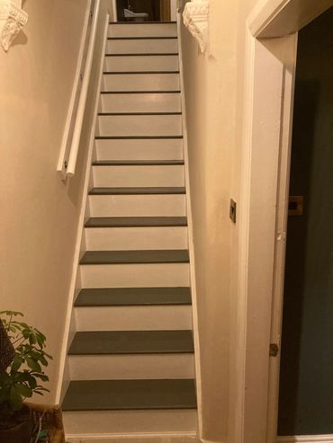 Hall stairs and landing with plaster repairs and stairs painted with floor paint