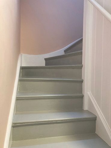 Stairs and floor stripped of lead based paint and restored and painted to make the stairs beautiful