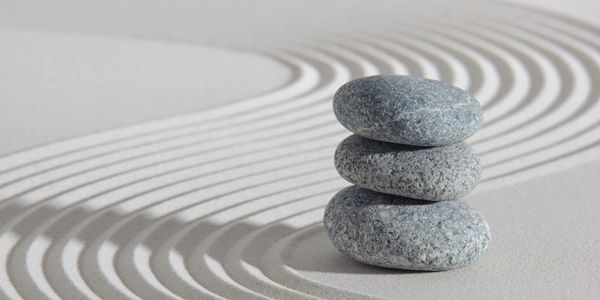 Three stones in Zen garden represent Bodhi Tree Solutions LLC values of wisdom, respect, and courage