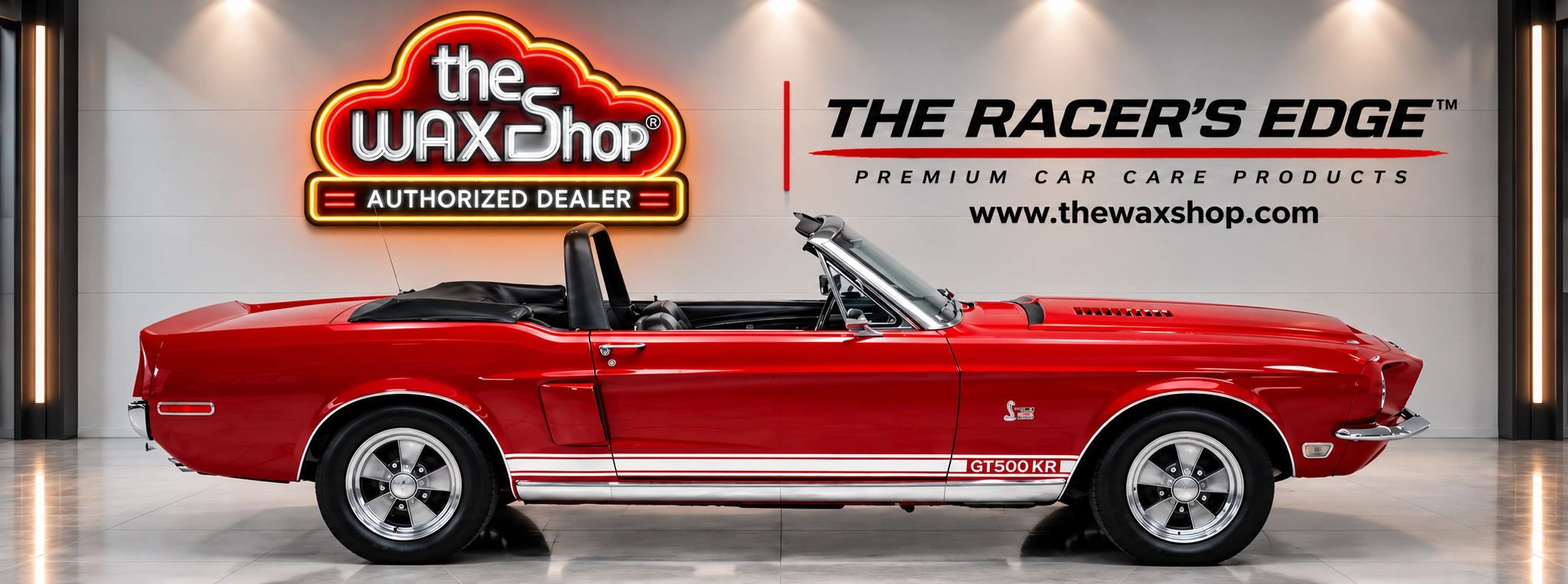Red classic convertible GT500 KR car in showroom.