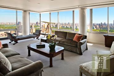 Luxurious living room with panoramic city views.
