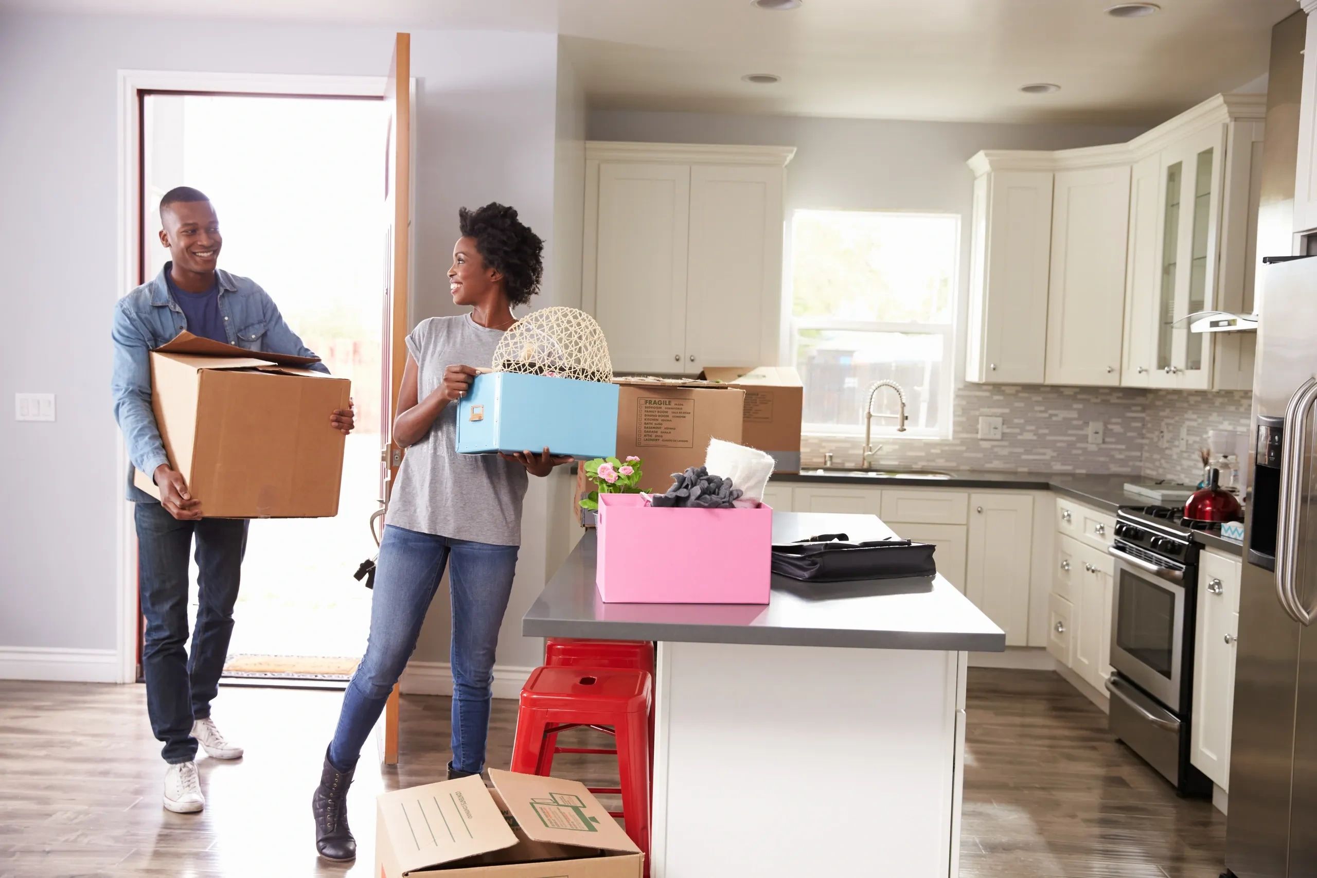 Couple happily moving into a new home.