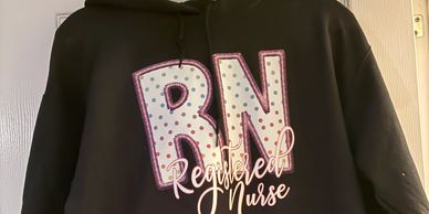 Black hoodie with faux embroidery “RN, Registered Nurse “ design