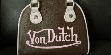 Von Dutch bowling ball purse.