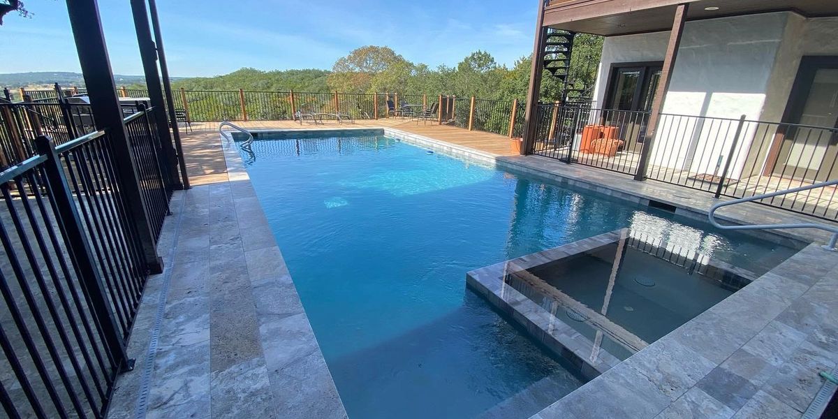 Evening ambiance by the poolside fire pit in a custom outdoor lounge